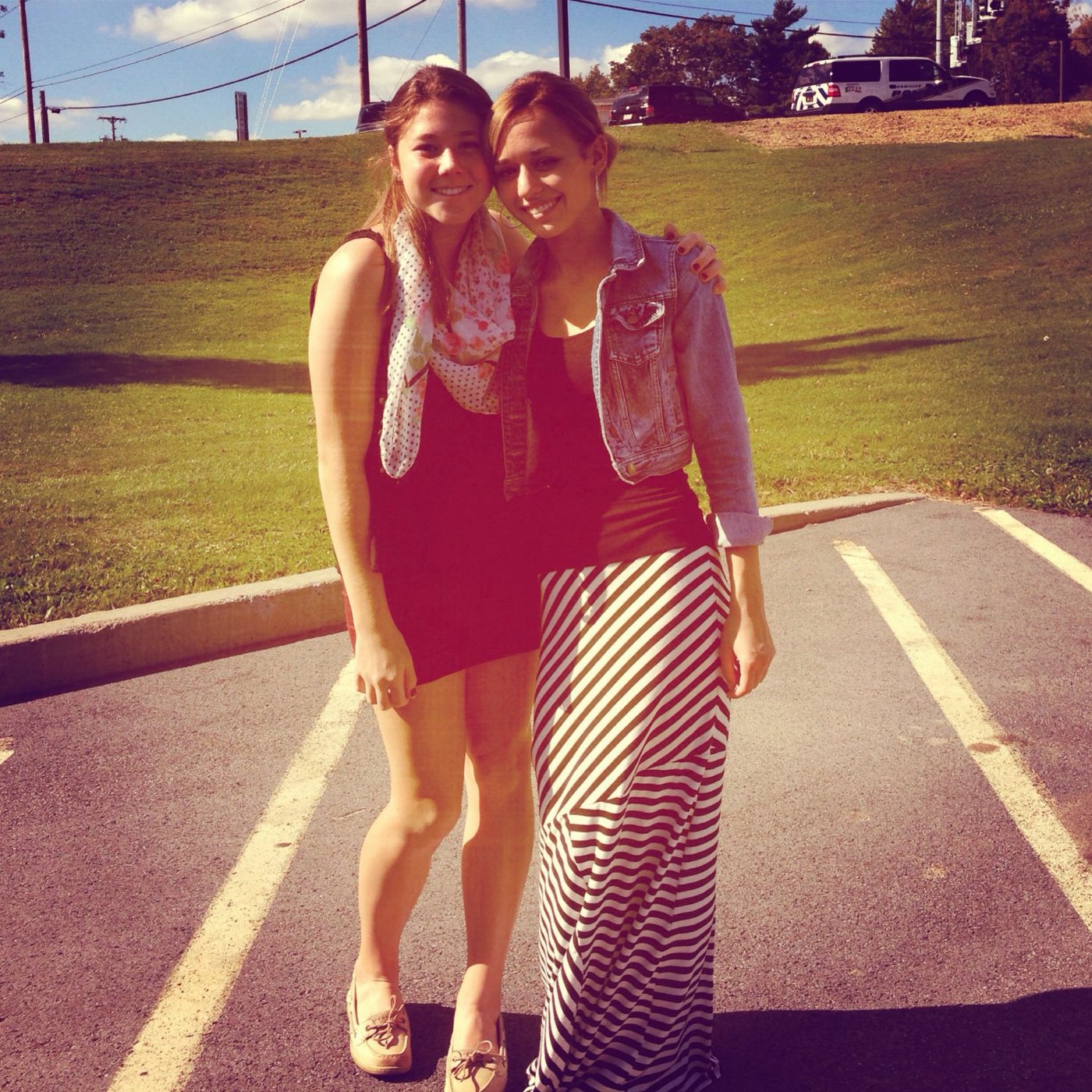 Two friends dressed up on a sunny afternoon